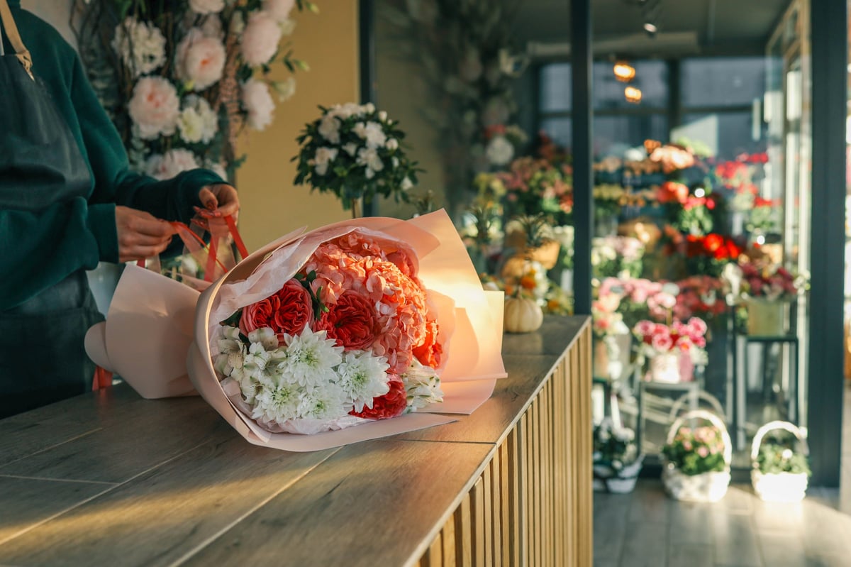 Luxurious floral bouquet with vibrant red roses, hydrangeas, and alstroemerias